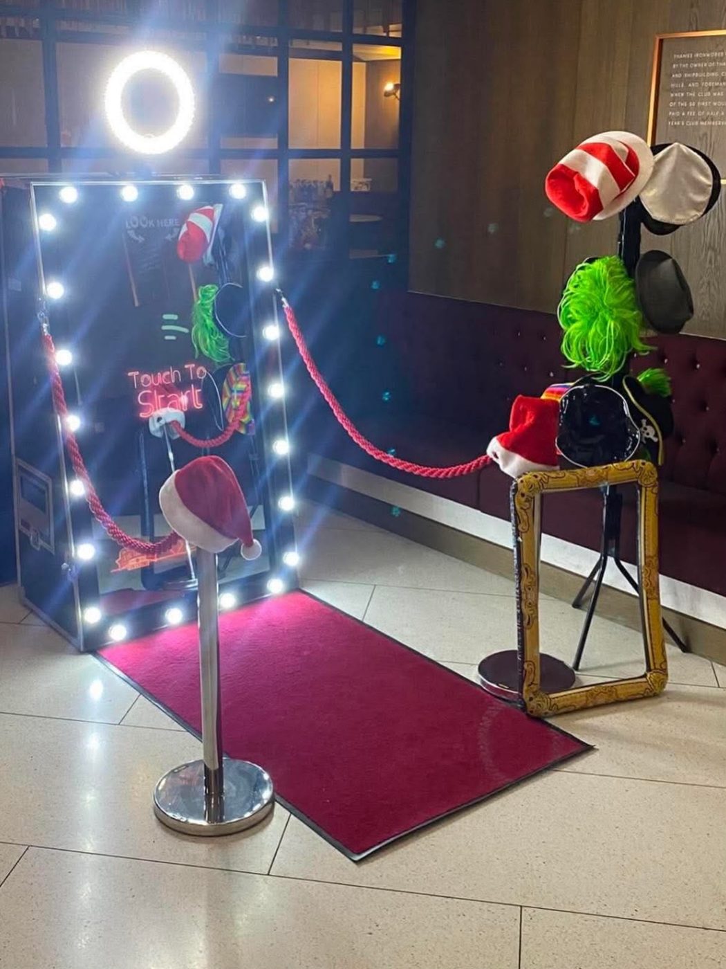 Magic Mirror booth with props stand and red carpet in a hotel lobby